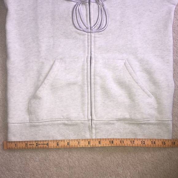 Very light grey TNA zip up with light purple logo - Picture 8 of 11